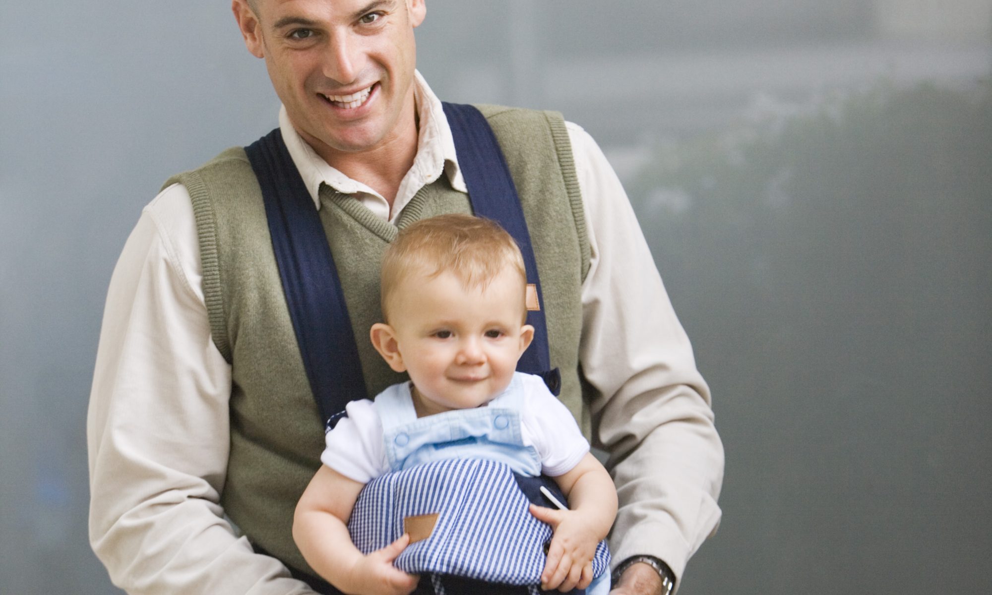 Father with baby in baby carrier